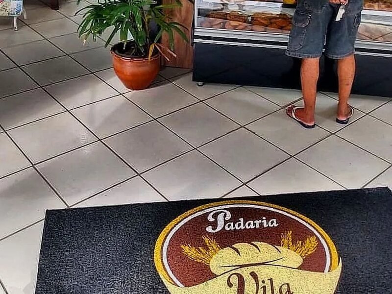 Capa do guia "Tapetes personalizados para cafeterias" sobre Tapetes personalizados